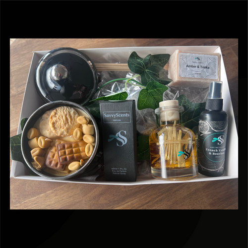 Luxury gift hamper featuring coffee candle, amber soap, and La Nuit-inspired fragrance for evening rituals